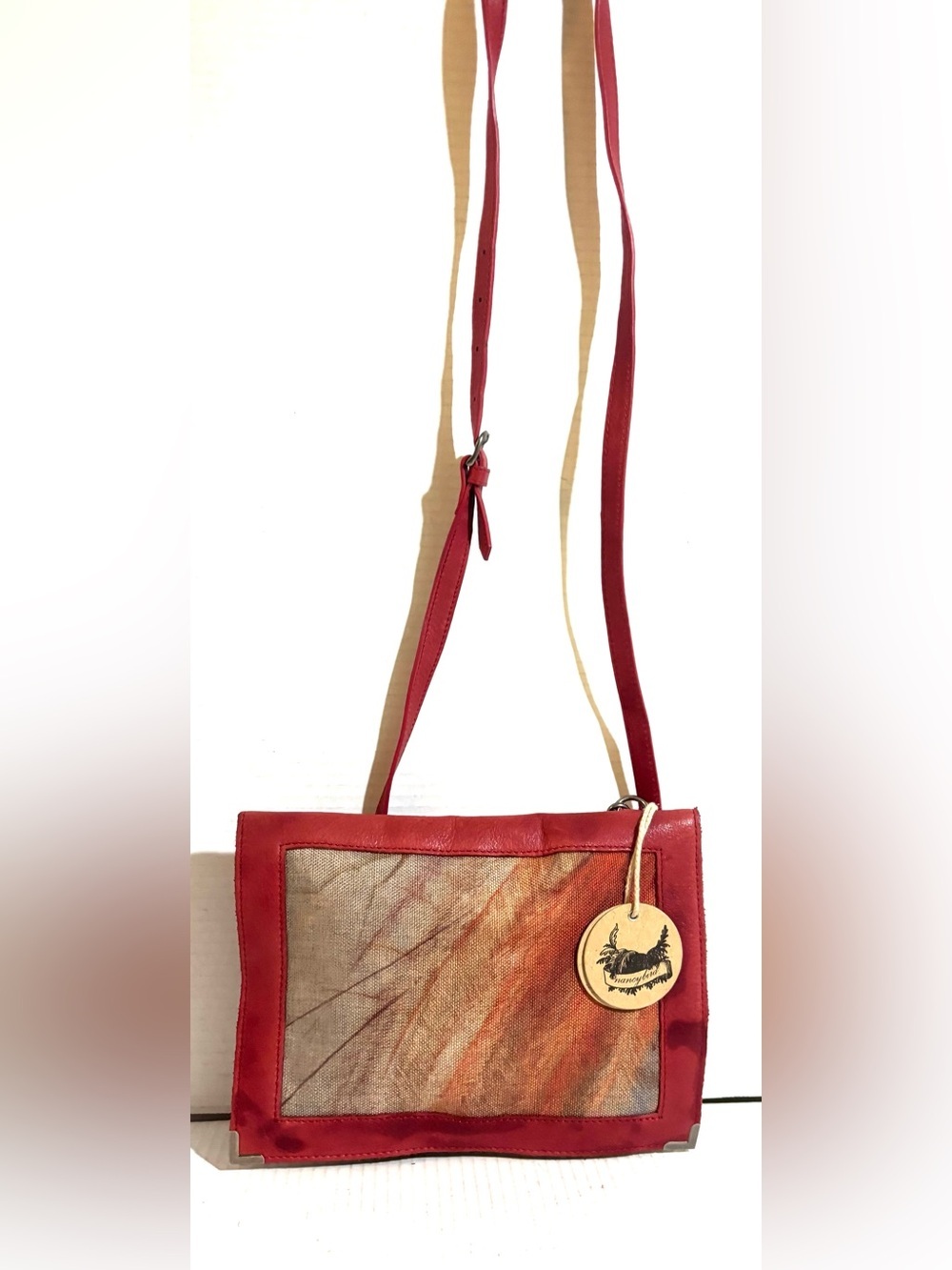 Red Leather-Trimmed Crossbody Bag with Artistic Front Panel